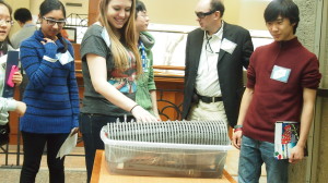 Delegates at Science Expo 2013 play with the Hydraulophone, a liquid instrument invented by Dr. Steve Mann. 