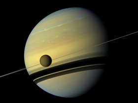 Titan against Saturn. Credit: NASA