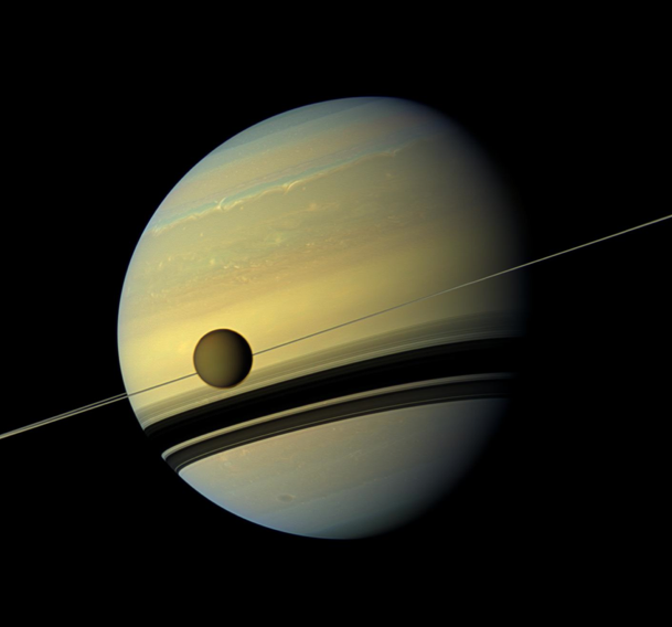 Titan against Saturn. Credit: NASA