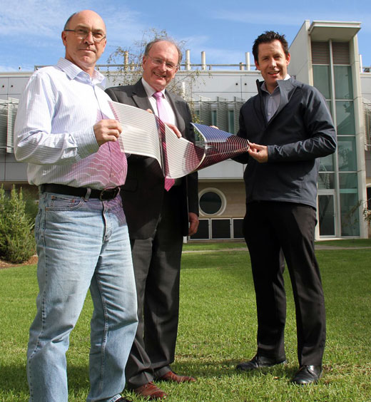 Dr David Jones, Professor Andrew Holmes and Dr Scott Watkins, three of the researchers involved, together with one of their printed solar cells.